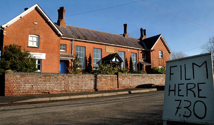 Two-story red brick village hall
