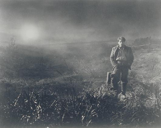 White man in moonlit, misty exterior